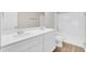 Bathroom with a double sink vanity with white cabinets and a shower-tub combo at 340 Albrighton Way, Moncks Corner, SC 29461