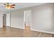 Bedroom with hardwood floors, ceiling fan and view of a bathroom at 340 Albrighton Way, Moncks Corner, SC 29461
