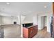 Open-concept kitchen featuring a breakfast bar and seamless transition into the adjacent living area at 340 Albrighton Way, Moncks Corner, SC 29461