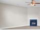 Cozy living room with a classic fireplace and modern ceiling fan, perfect for relaxation at 340 Albrighton Way, Moncks Corner, SC 29461