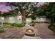 Charming backyard with brick patio and fire pit, perfect for outdoor entertaining and relaxation at 344 Lantana Dr, Charleston, SC 29407
