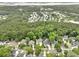 Drone shot of neighborhood with houses, trees, and a waterway at 3520 E Higgins Dr, Mount Pleasant, SC 29466