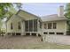 Yellow home features a screened in back porch and patio at 3520 E Higgins Dr, Mount Pleasant, SC 29466