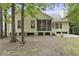 This yellow home features a screened in back porch and patio at 3520 E Higgins Dr, Mount Pleasant, SC 29466