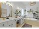 Bright bathroom features double sink vanity, garden tub, and indoor plants at 3520 E Higgins Dr, Mount Pleasant, SC 29466