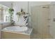 Bathroom features an oval soaking tub next to a clear glass shower at 3520 E Higgins Dr, Mount Pleasant, SC 29466