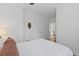 Bright bedroom with white walls, ceiling fan, and double door closet at 3520 E Higgins Dr, Mount Pleasant, SC 29466