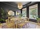 Elegant dining room showcases a large wooden table, decorative rug, and natural light from windows at 3520 E Higgins Dr, Mount Pleasant, SC 29466