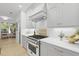 Gourmet kitchen with stainless steel range, white cabinetry, and sleek countertops at 3520 E Higgins Dr, Mount Pleasant, SC 29466