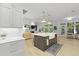 Modern kitchen with a large island, farmhouse sink, and open view to the living area at 3520 E Higgins Dr, Mount Pleasant, SC 29466