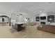 Open concept living space featuring kitchen island, modern lighting, and fireplace with built-in shelving at 3520 E Higgins Dr, Mount Pleasant, SC 29466