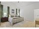 Bright main bedroom with ceiling fan, hardwood floors, and natural lighting at 3520 E Higgins Dr, Mount Pleasant, SC 29466
