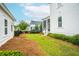 Well-manicured backyard showcasing a trampoline and access to the home's screened-in porch at 3707 Gambrill Ln, Mount Pleasant, SC 29466