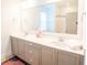 Bathroom featuring double sinks, stone countertops, and traditional cabinets at 3707 Gambrill Ln, Mount Pleasant, SC 29466