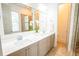 Bathroom featuring a double vanity with modern fixtures, a large mirror, and ample counter space at 3707 Gambrill Ln, Mount Pleasant, SC 29466