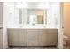 Stylish bathroom featuring a double vanity, large mirror, modern fixtures, and neutral decor at 3707 Gambrill Ln, Mount Pleasant, SC 29466