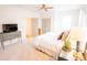 Bright bedroom with carpet, white bedding, dresser, and ceiling fan at 3707 Gambrill Ln, Mount Pleasant, SC 29466
