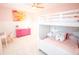 Charming bedroom with bunk bed and brightly painted pink dresser at 3707 Gambrill Ln, Mount Pleasant, SC 29466