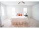 Bright bedroom with carpet, and white bedding, bedside table and ceiling fan at 3707 Gambrill Ln, Mount Pleasant, SC 29466