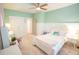 Stylish bedroom featuring mint walls, lots of natural light and modern décor at 3707 Gambrill Ln, Mount Pleasant, SC 29466