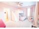 Bright, pink bedroom with bunk beds, white trim, and an adorable pink arm chair at 3707 Gambrill Ln, Mount Pleasant, SC 29466