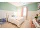 Bedroom featuring mint walls, natural light and desk area with chair at 3707 Gambrill Ln, Mount Pleasant, SC 29466