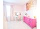 Bright bedroom with light pink walls, a vanity, artwork, and a pink dresser at 3707 Gambrill Ln, Mount Pleasant, SC 29466