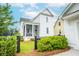 Charming home featuring a cozy front porch, fenced yard, and well-maintained landscaping at 3707 Gambrill Ln, Mount Pleasant, SC 29466