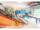 Well-organized garage with storage rack and sporting equipment at 3707 Gambrill Ln, Mount Pleasant, SC 29466