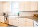 Kitchen with a farmhouse style sink, granite countertops, and stainless steel appliances at 3707 Gambrill Ln, Mount Pleasant, SC 29466