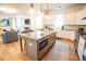 Open concept kitchen with a large island featuring granite countertops and stainless steel appliances at 3707 Gambrill Ln, Mount Pleasant, SC 29466