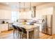 Open kitchen featuring an island with bar stool seating, granite countertops, and stainless steel appliances at 3707 Gambrill Ln, Mount Pleasant, SC 29466
