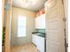 Bright laundry room featuring modern washer and dryer, with ample counter and cabinet space and stylish decor at 3707 Gambrill Ln, Mount Pleasant, SC 29466