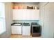 Functional laundry room with modern appliances, plenty of storage, and sleek countertops at 3707 Gambrill Ln, Mount Pleasant, SC 29466