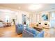 Bright and airy living area with hardwood floors connecting to the dining area at 3707 Gambrill Ln, Mount Pleasant, SC 29466