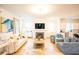 Open-concept living room with fireplace, modern furniture, and hardwood floors at 3707 Gambrill Ln, Mount Pleasant, SC 29466