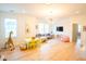 Spacious living room with hardwood floors, large windows, a playful giraffe and plenty of seating at 3707 Gambrill Ln, Mount Pleasant, SC 29466