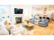 Open-concept living and kitchen area with fireplace and hardwood floors throughout at 3707 Gambrill Ln, Mount Pleasant, SC 29466