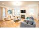Cozy living room featuring fireplace, hardwood floors, and comfortable seating at 3707 Gambrill Ln, Mount Pleasant, SC 29466