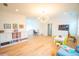 Bright, open living room with hardwood floors, a play area and comfortable seating at 3707 Gambrill Ln, Mount Pleasant, SC 29466