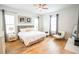 Inviting bedroom featuring a comfortable bed, hardwood floors, and natural light from multiple windows at 3707 Gambrill Ln, Mount Pleasant, SC 29466