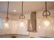 Three pendant lights hanging above the kitchen island at 3707 Gambrill Ln, Mount Pleasant, SC 29466