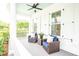 Cozy front porch features comfortable seating and a ceiling fan, perfect for relaxing and enjoying the outdoors at 3707 Gambrill Ln, Mount Pleasant, SC 29466