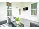 Relaxing back porch with outdoor seating and a TV, perfect for entertaining or unwinding outdoors at 3707 Gambrill Ln, Mount Pleasant, SC 29466