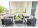 Inviting front porch features stylish seating, perfect for enjoying the outdoors and neighborhood views at 3707 Gambrill Ln, Mount Pleasant, SC 29466