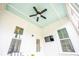Stylish back porch with TV and ceiling fan for comfortable outdoor living and entertainment at 3707 Gambrill Ln, Mount Pleasant, SC 29466