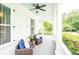 Inviting front porch featuring comfortable seating and a ceiling fan, perfect for relaxing and enjoying the outdoors at 3707 Gambrill Ln, Mount Pleasant, SC 29466