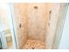 Walk-in shower featuring tiled walls, mosaic floor, and glass door at 3707 Gambrill Ln, Mount Pleasant, SC 29466