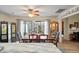 Sunlit dining room features wood floors, a ceiling fan, and a dark wood table for Gathering gatherings at 39 Indigo Ln, Goose Creek, SC 29445