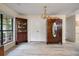 Open dining area with hardwood floors, a display cabinet, and a view of the backyard at 39 Indigo Ln, Goose Creek, SC 29445